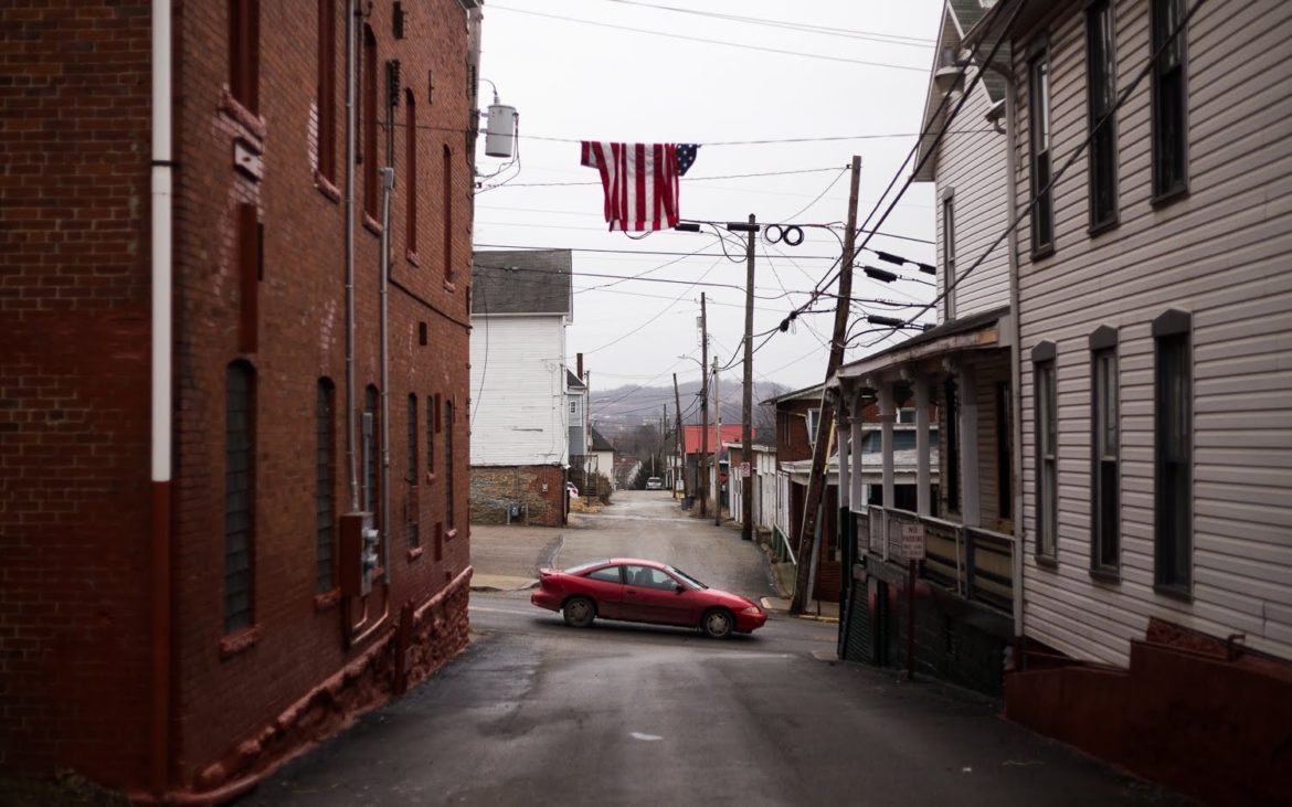 A car travels down South Washington Street in Waynesburg, the largest municipality in Greene county with a population of 4,176. (Photo by John Hamilton/PublicSource)