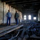 Brothers Michael (left) and Nicholas (right) Troiani in one of their buildings in Downtown Pittsburgh's Firstside district. They say deteriorating brick makes it impossible to save the structures. (Photo by Jay Manning/PublicSource)