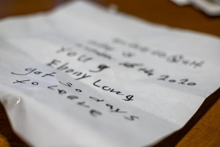 A handwritten note received by Ebony Long, mother of three, from her landlord, giving her "30 days to leave" the Perry North house which she now rents. (Photo by Jay Manning/PublicSource)