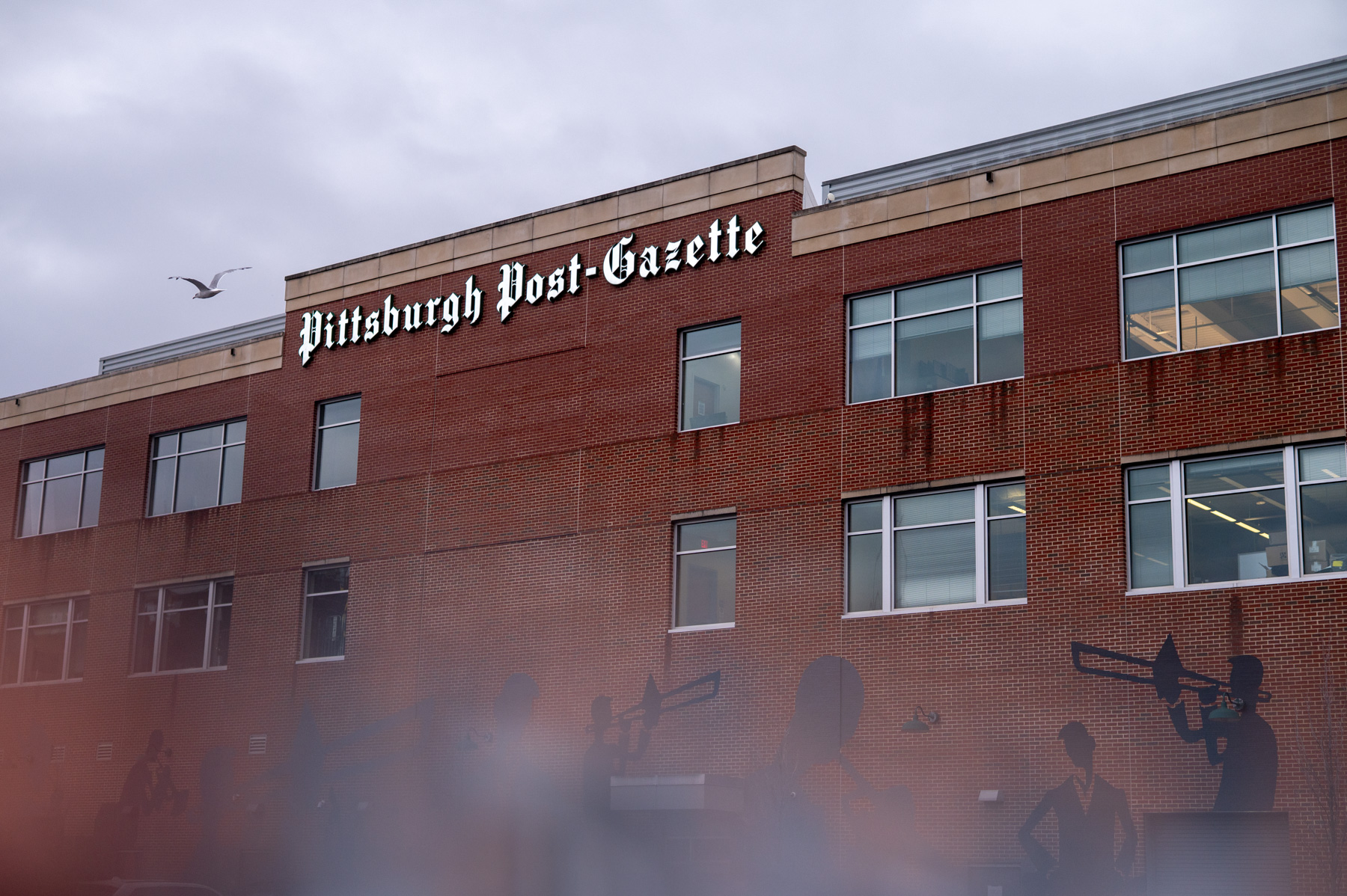 A brick building with the sign