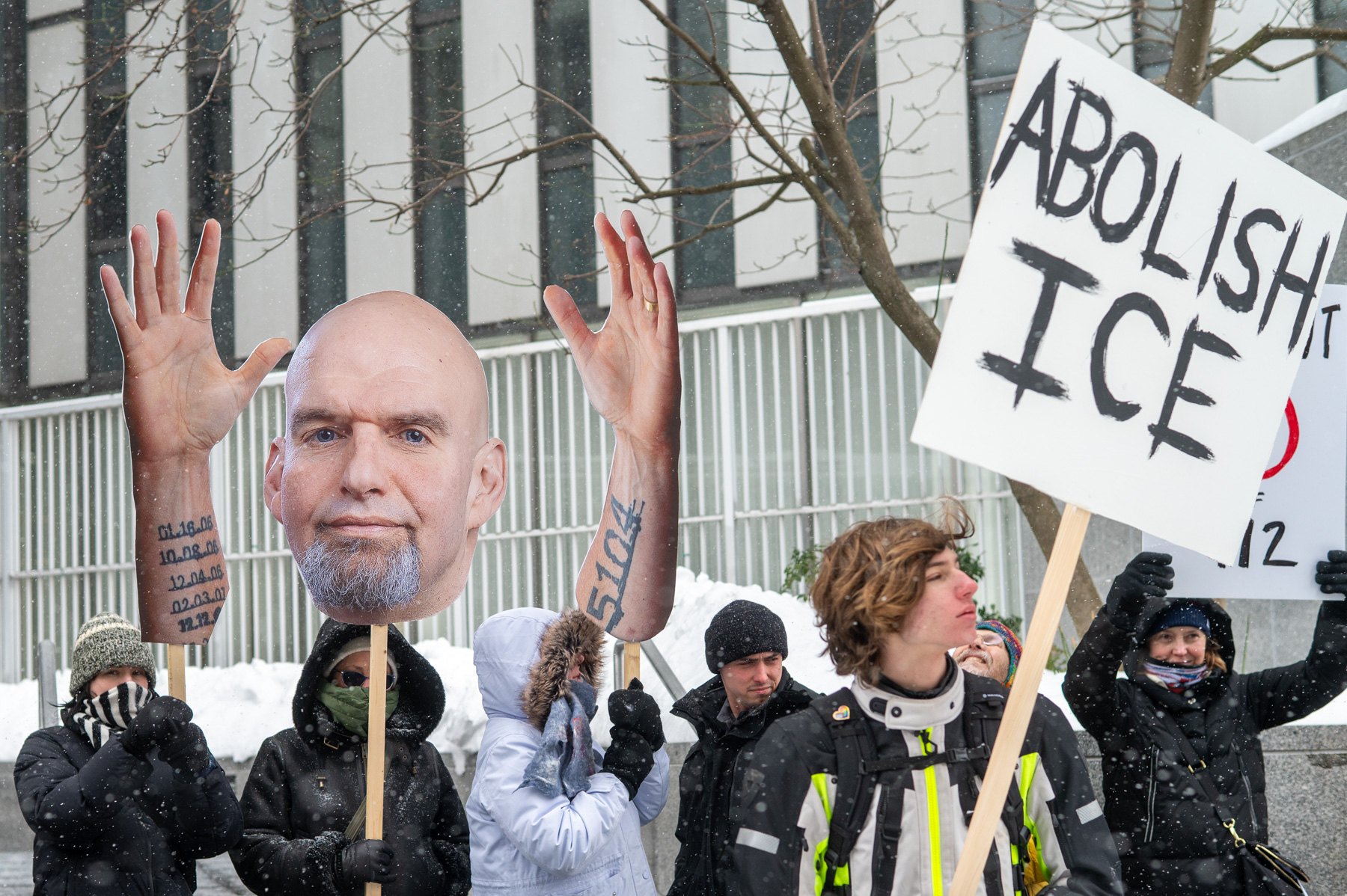 Protesters brave the freeze to press Fetterman on DHS funding amid ICE shootings