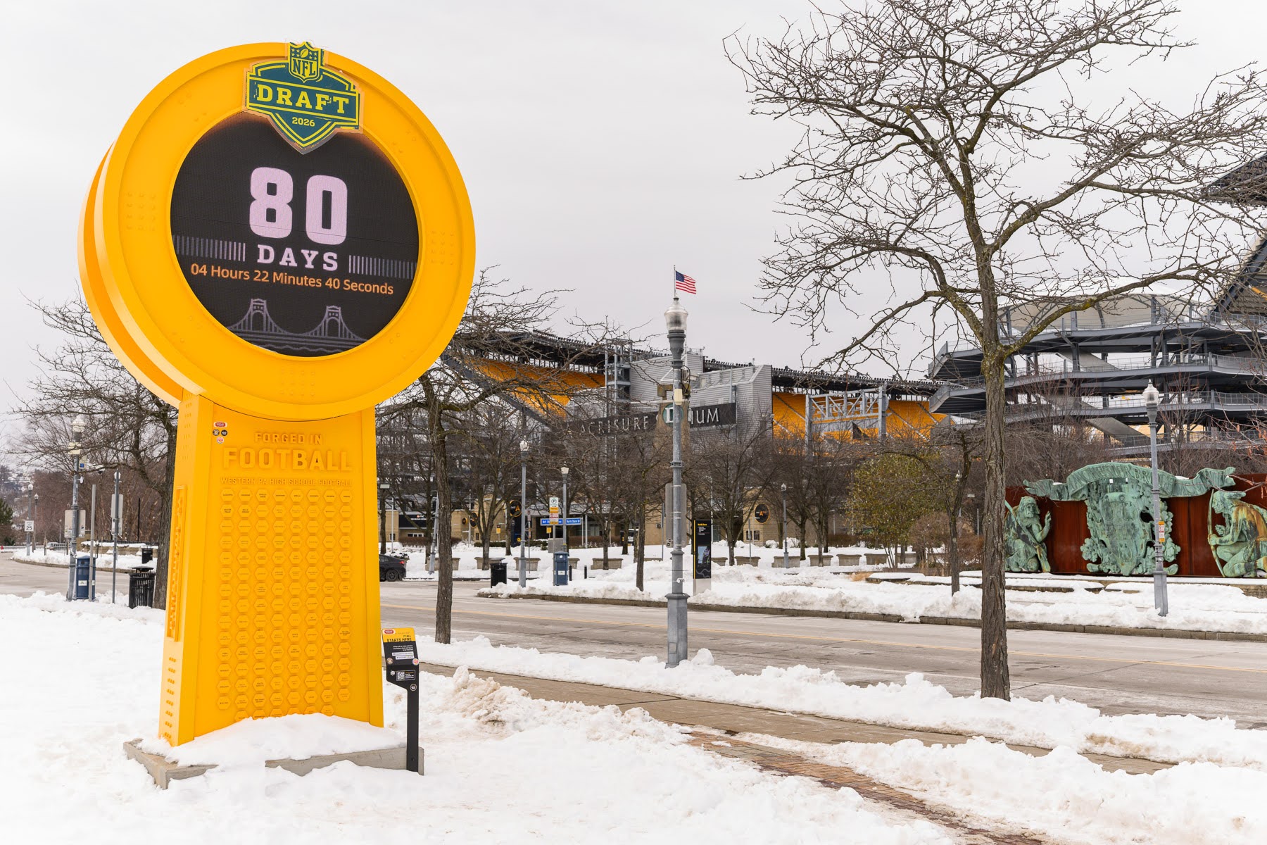 A large yellow NFL Draft countdown clock displays